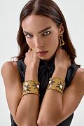 Широкий браслет-манжета с декоративными элементами